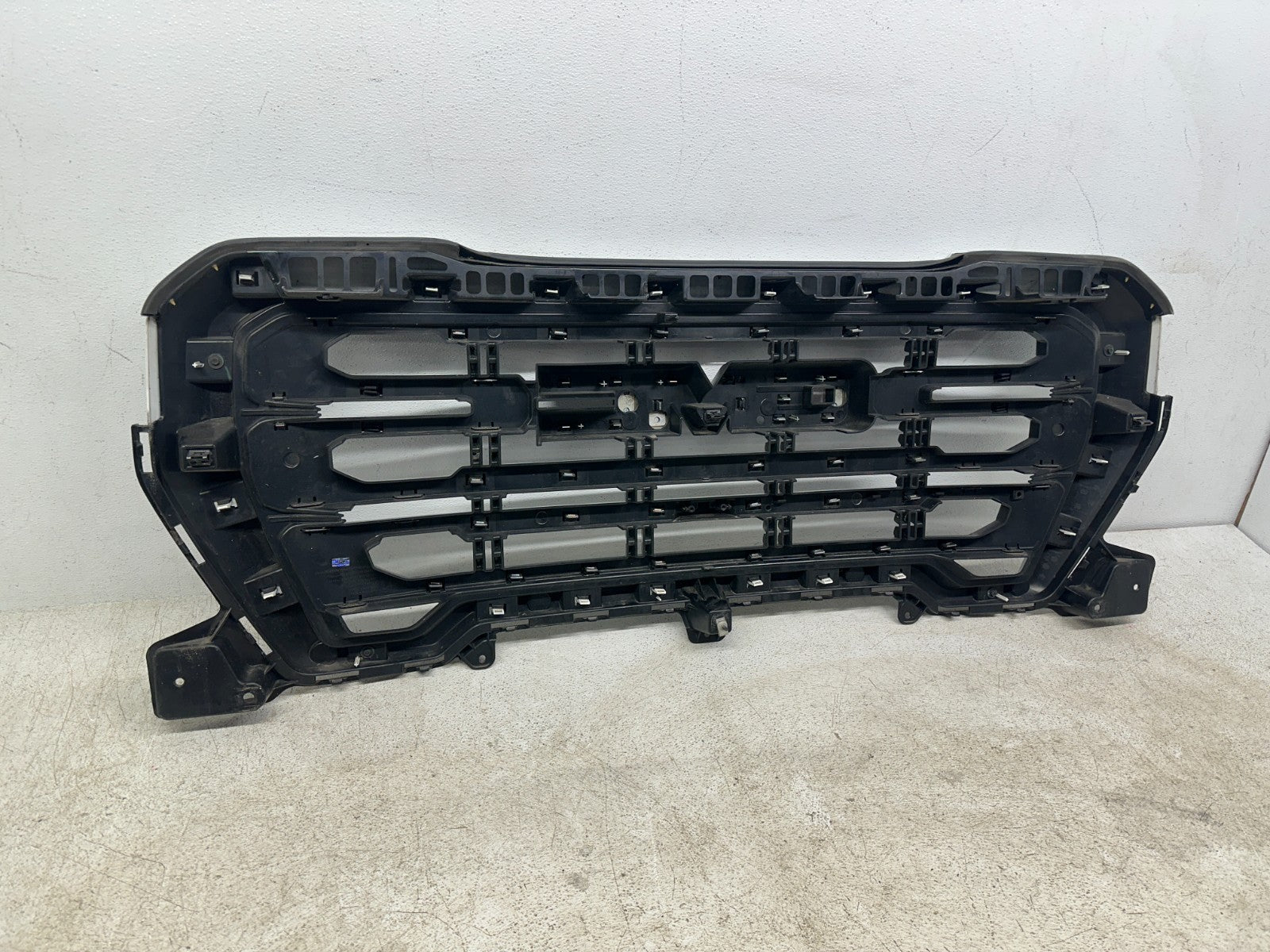 GMC Sierra 1500 OEM grille finish detail
