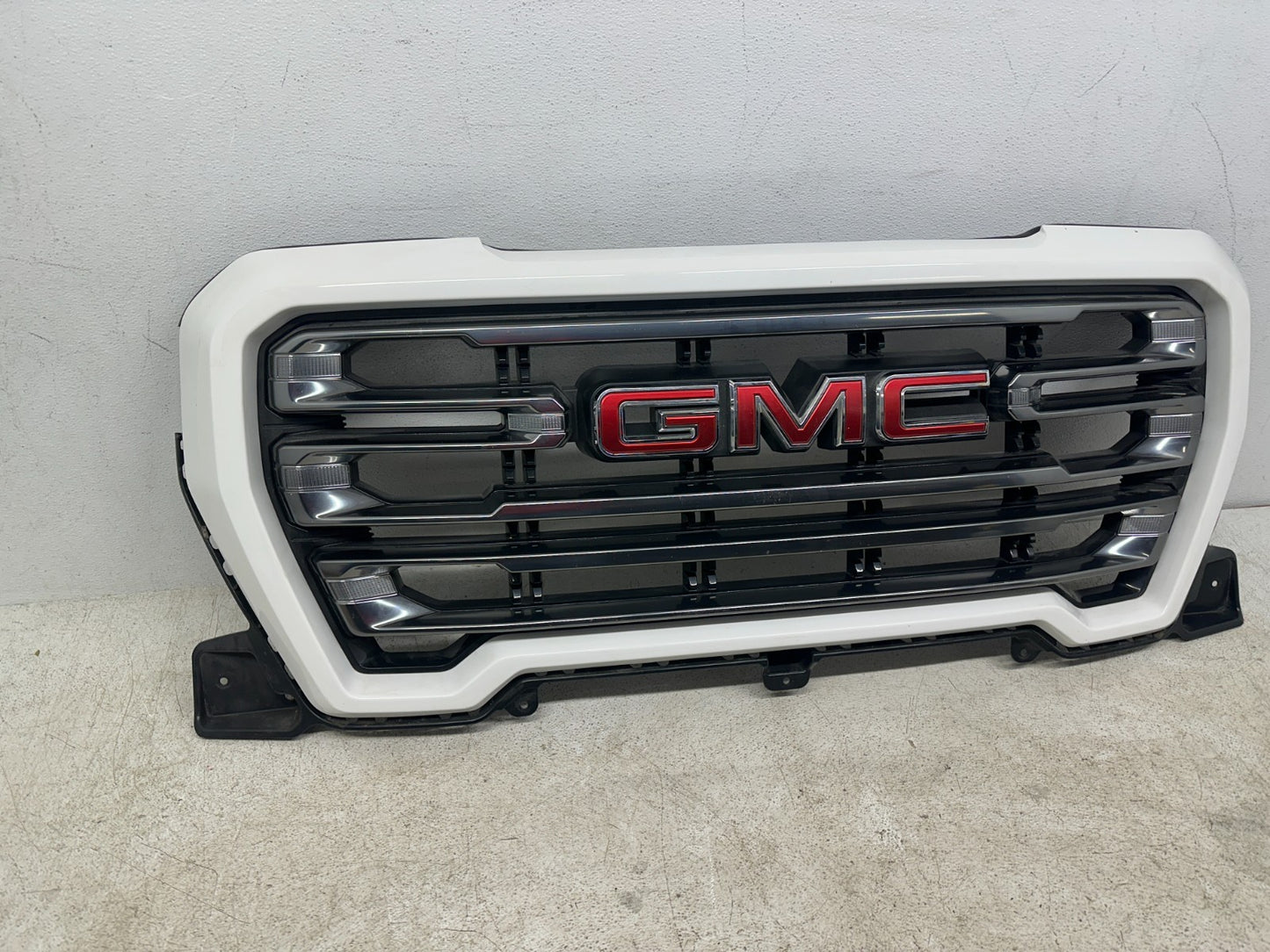 GMC Sierra 1500 OEM grille rear mounting tabs