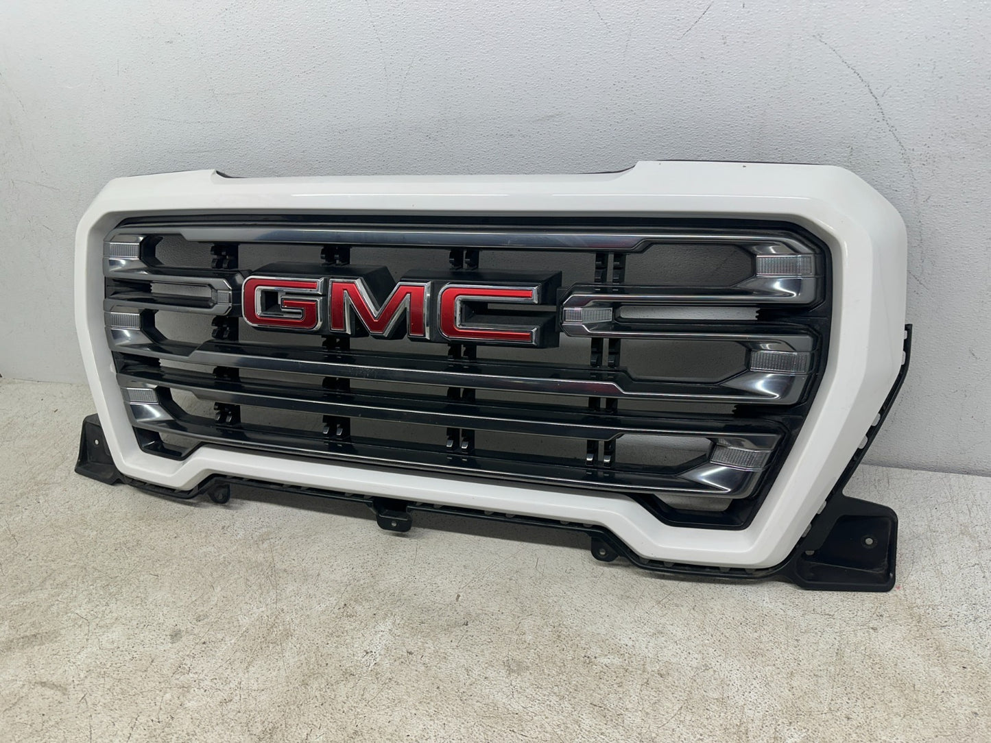 GMC Sierra 1500 OEM grille angle view