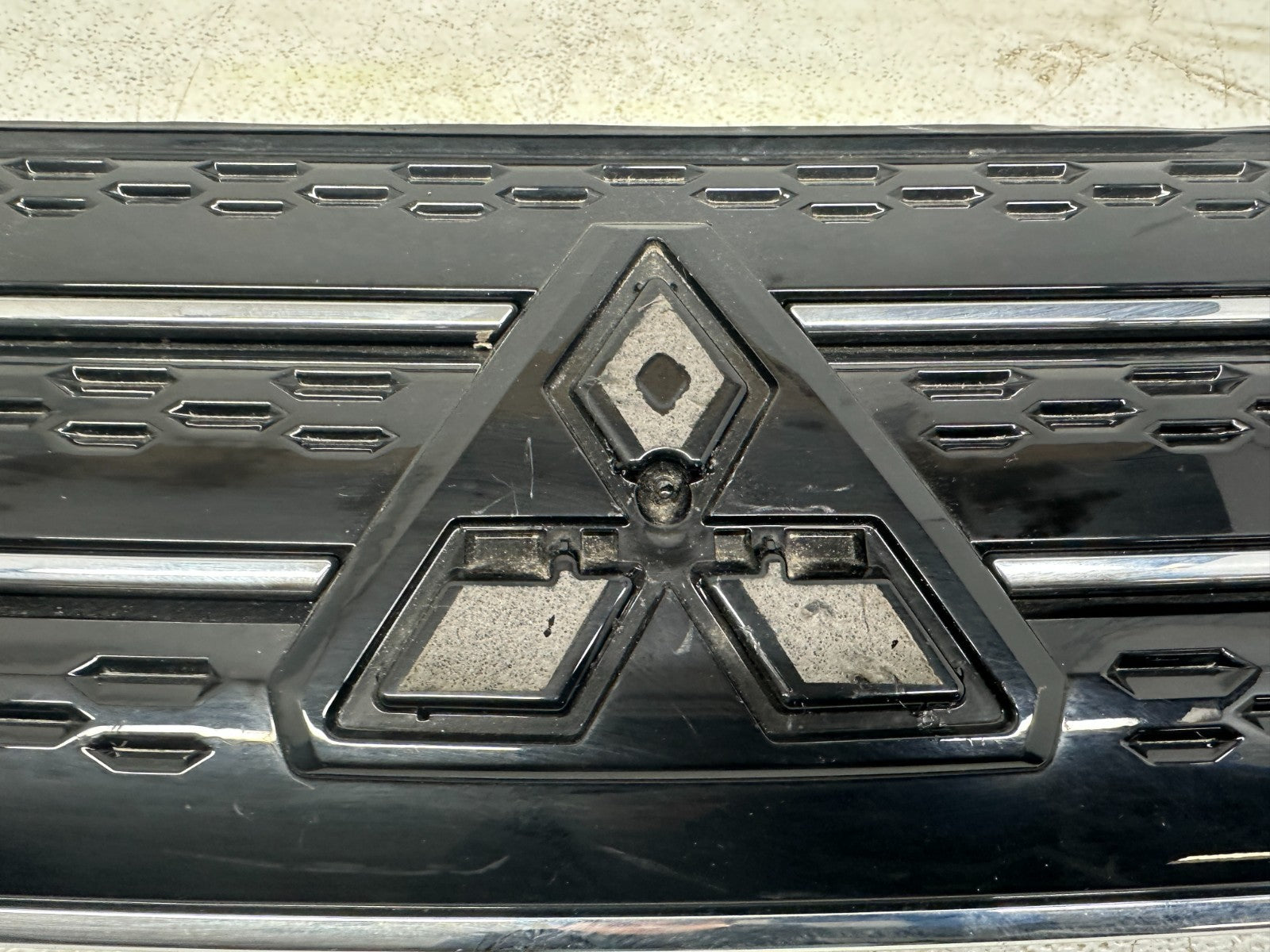 Mitsubishi Outlander front grille — surface condition detail