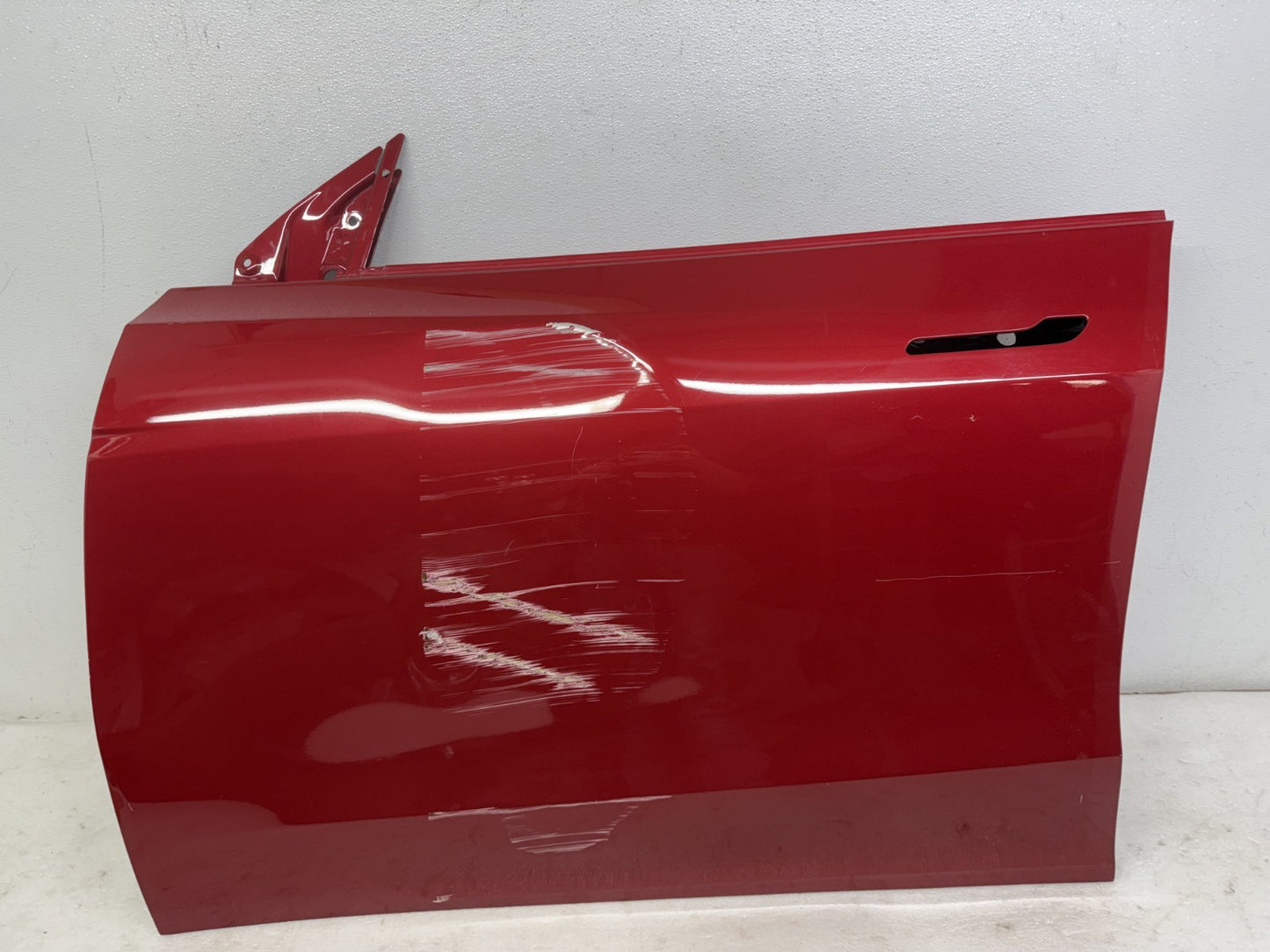 Tesla Model Y front door scratch and dent detail