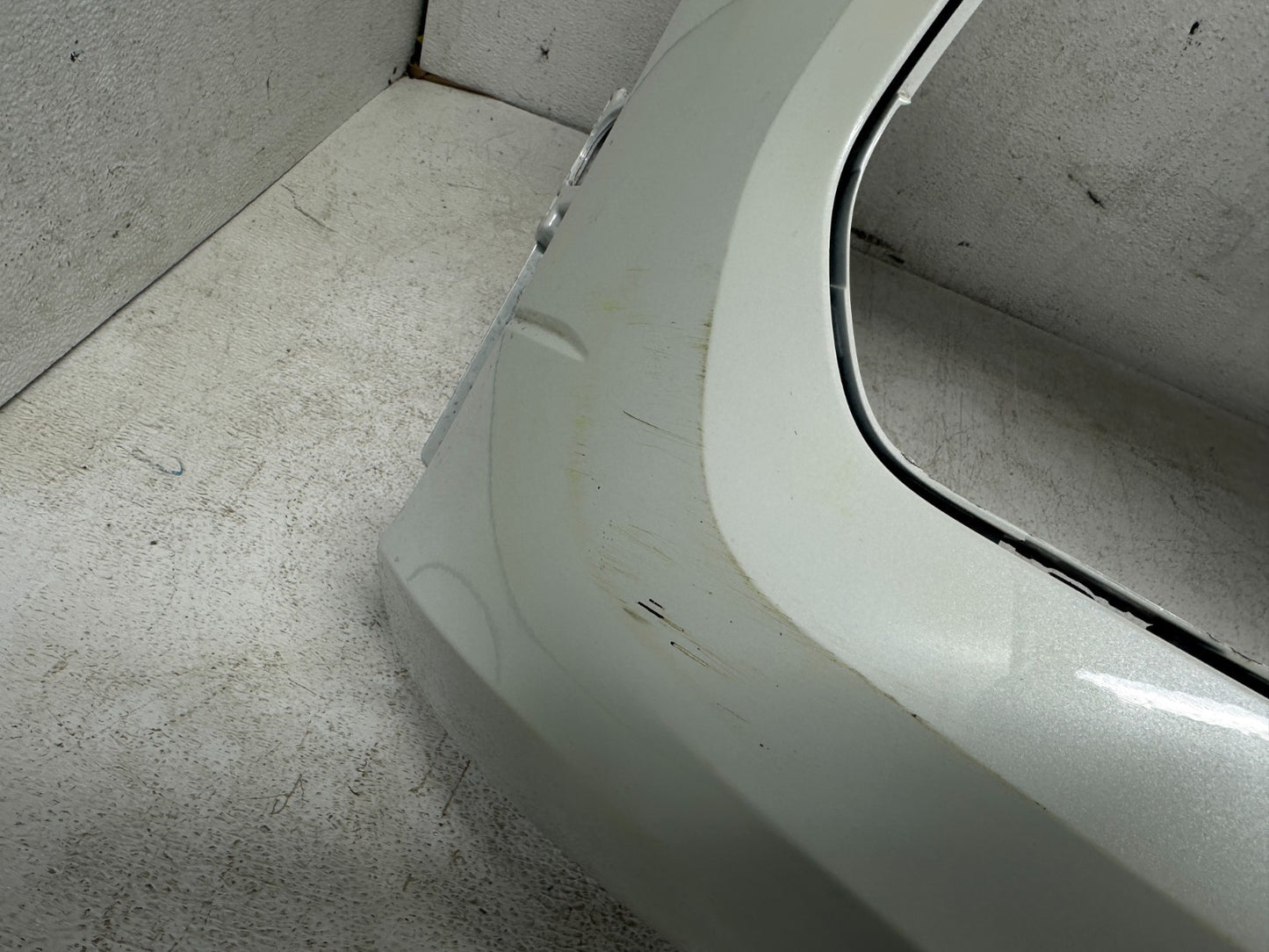 VW Tiguan front bumper cover — surface detail with scratches