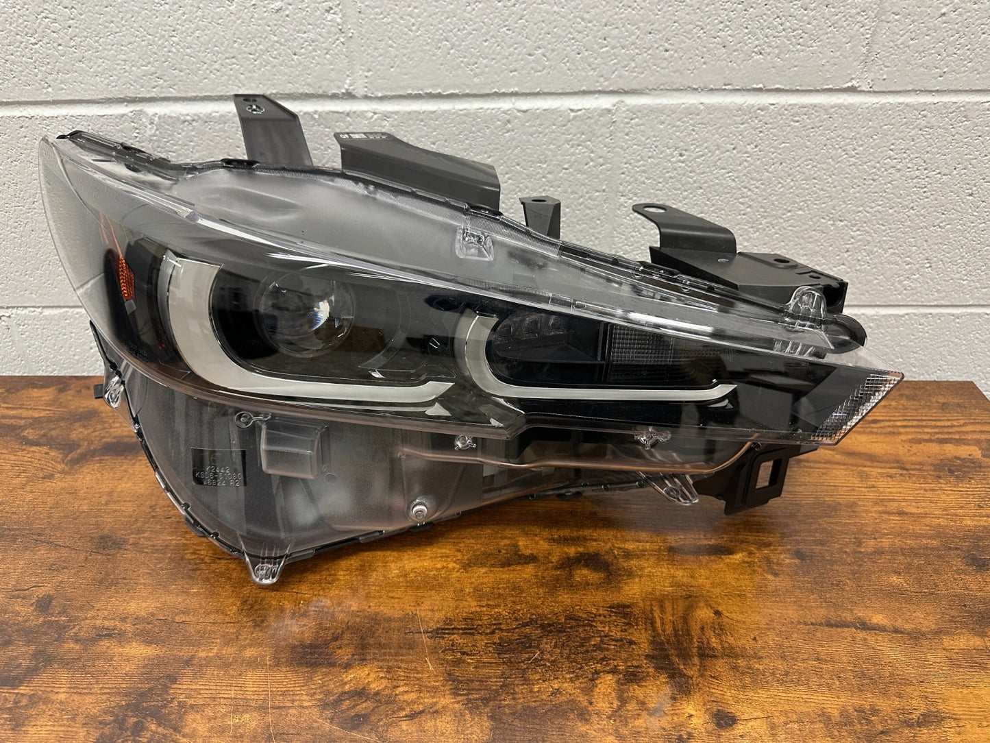 Mazda CX-5 RH headlight mounting tabs