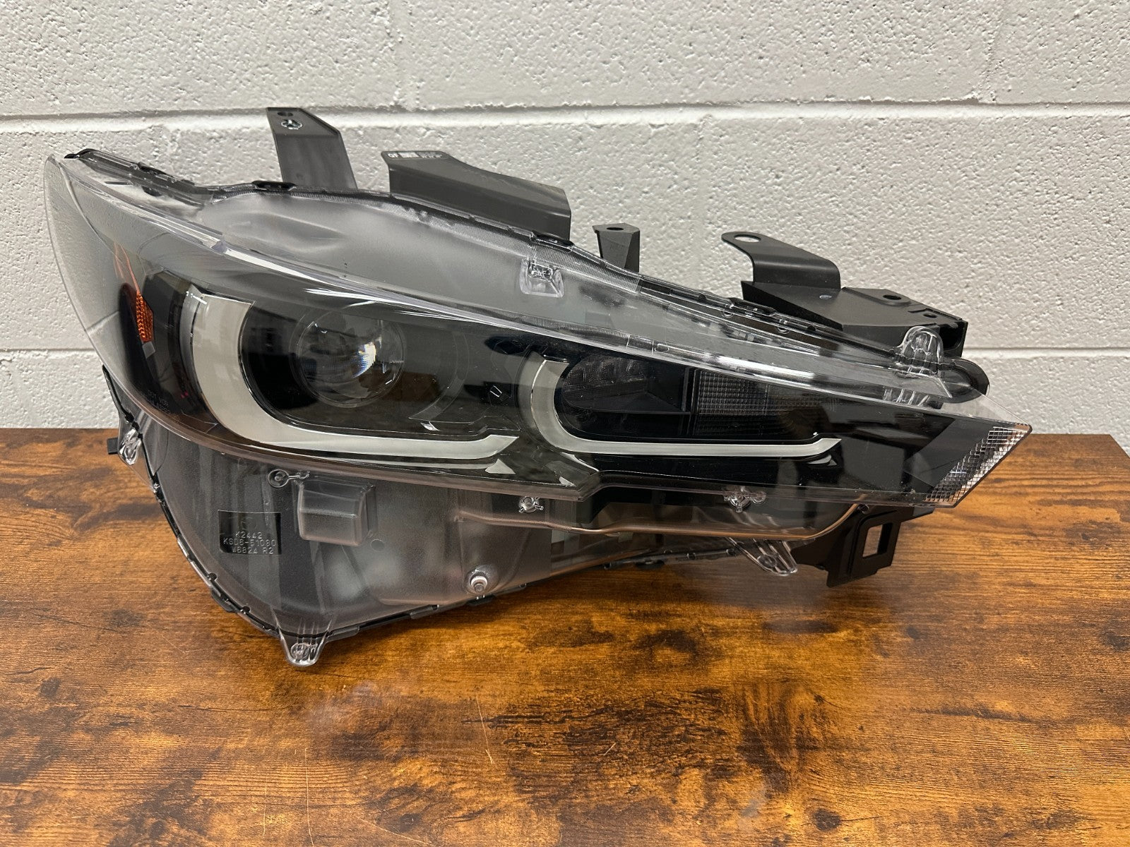 Mazda CX-5 RH headlight mounting tabs