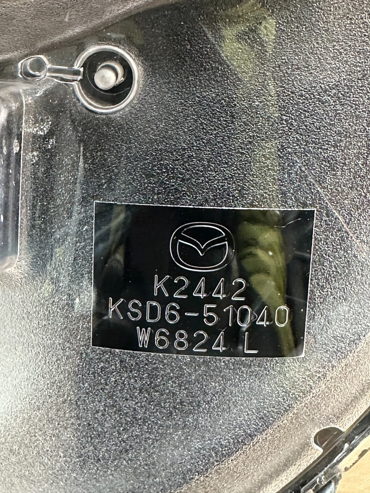 Mazda CX-5 OEM headlight mounting tabs