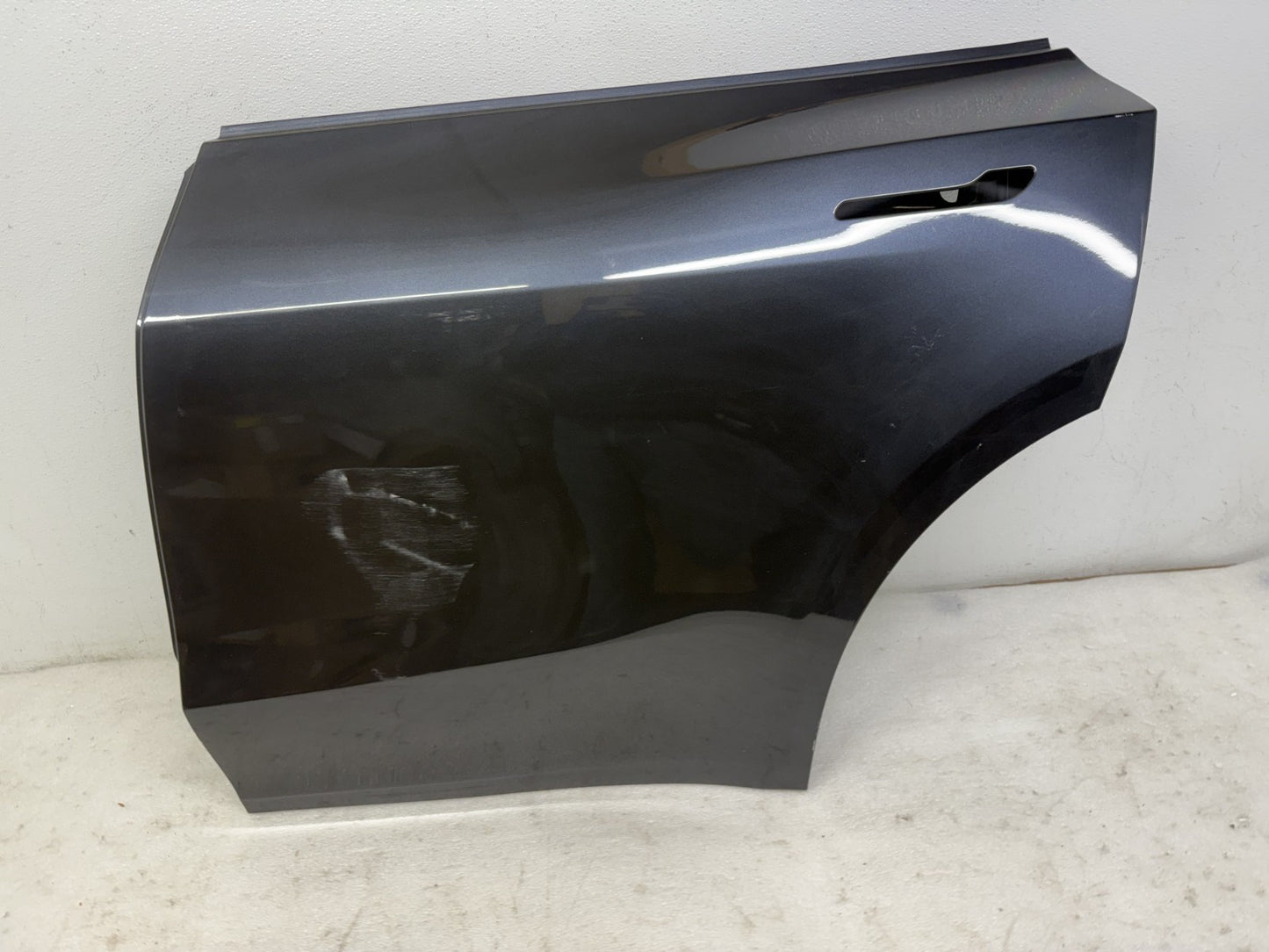 Tesla Model Y rear door scratch and dent detail