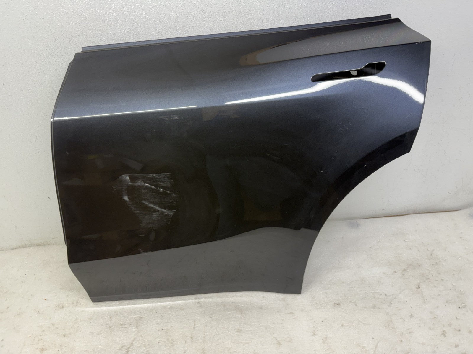 Tesla Model Y rear door scratch and dent detail